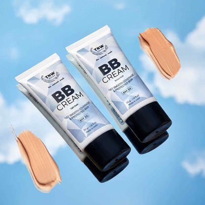 Two tubes of BB cream with swatches on a blue sky background